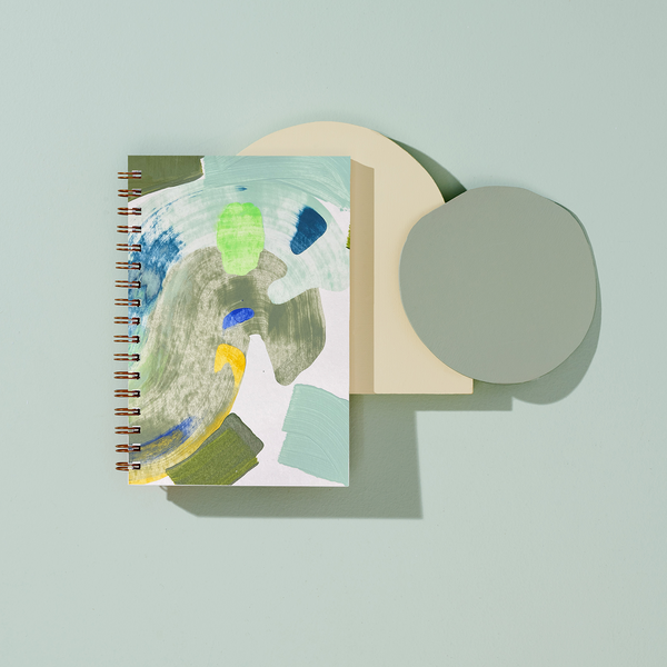Moglea Cove Notebook with soft cover and lined pages, featuring a minimalist design suitable for writing and note-taking.