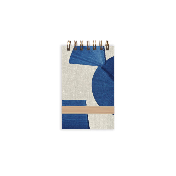 Indigo tiny notebook by Moglea with soft cover and lined pages, ideal for jotting notes and sketches.