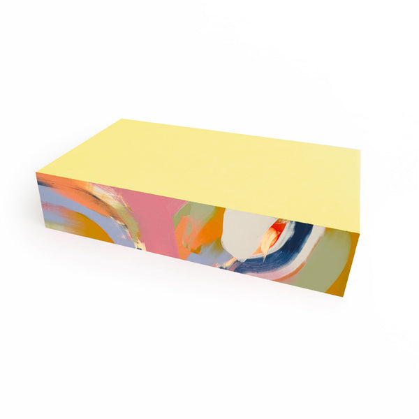 Medium Canary Swirl notepad by Moglea with a vibrant yellow and white swirl cover, perfect for notes and sketches.