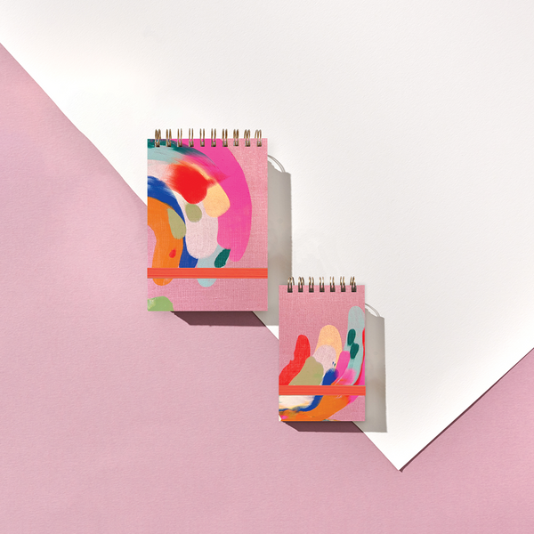 Small Moglea Palmita Tiny Notebook with a colorful, illustrated cover, perfect for jotting notes on the go.