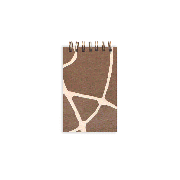 Moglea Tiny Notebook titled Surprise Second, featuring a compact, illustrated cover and lined pages for jotting notes.
